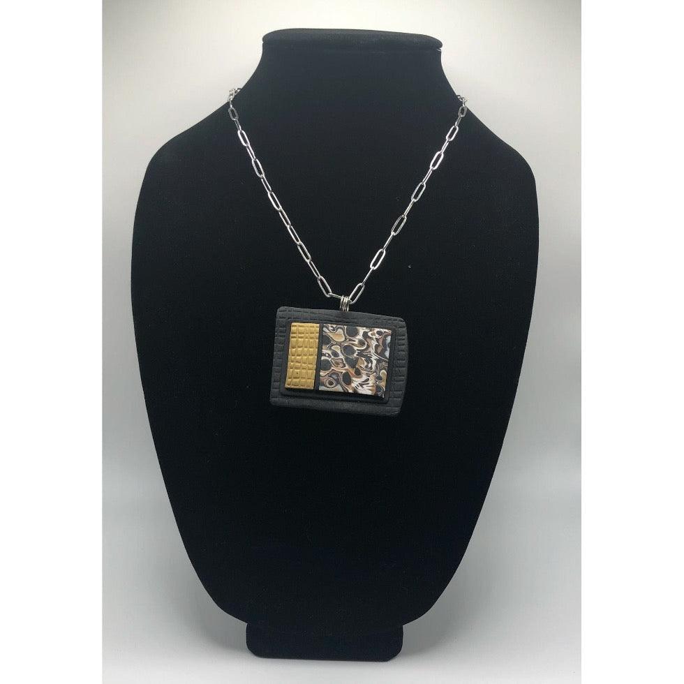Black and white with gold pendant
