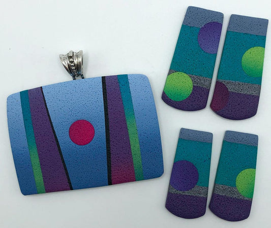 Graphic pendant with matching earrings