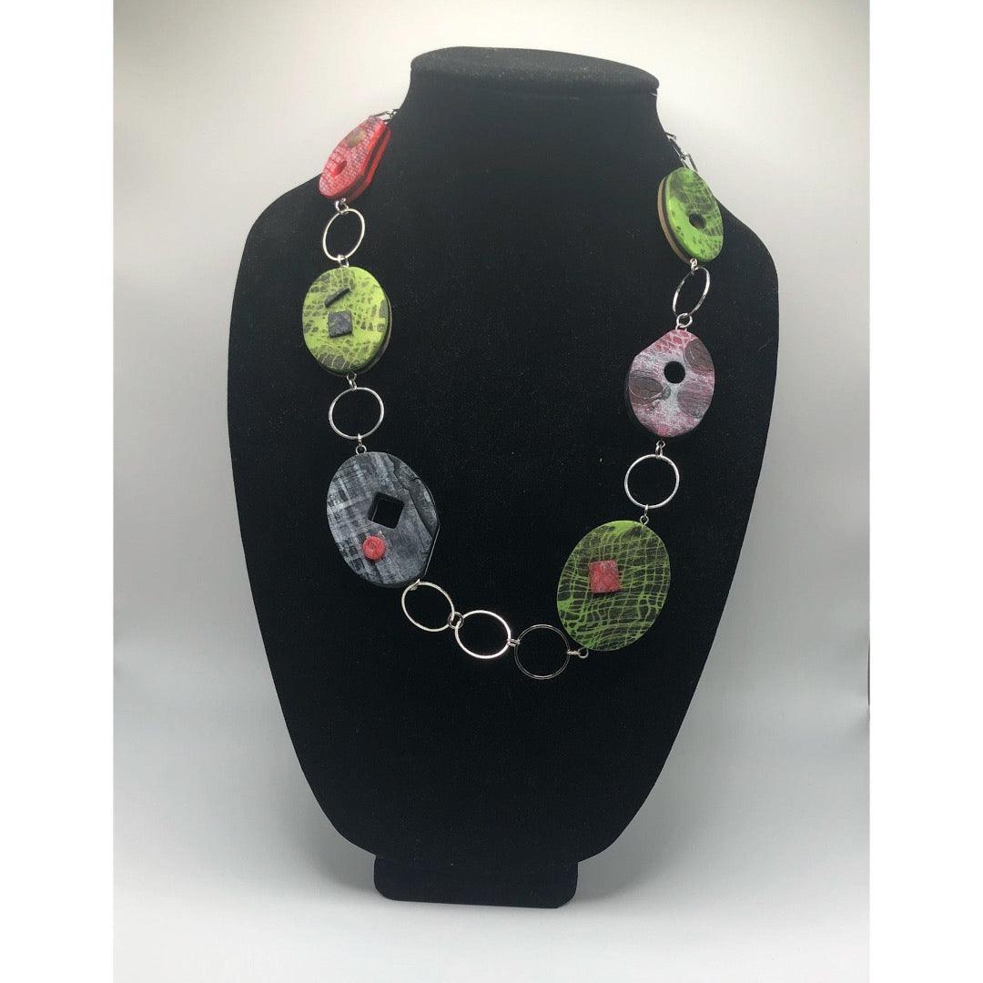 black green necklace with a pop of red